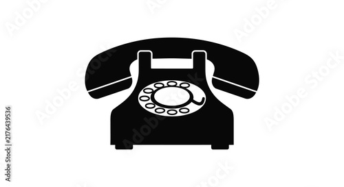 Vintage rotary telephone with handset rests on a white surface black silhouette