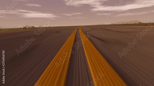 Tracking camera starting near parallel yellow ridges moving toward airfield showing lines meeting