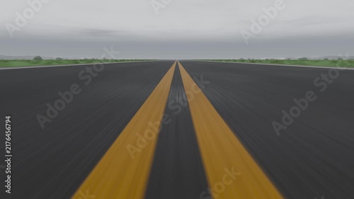 Moving camera forward over runway yellow center stripes sliding with green shoulders for approach