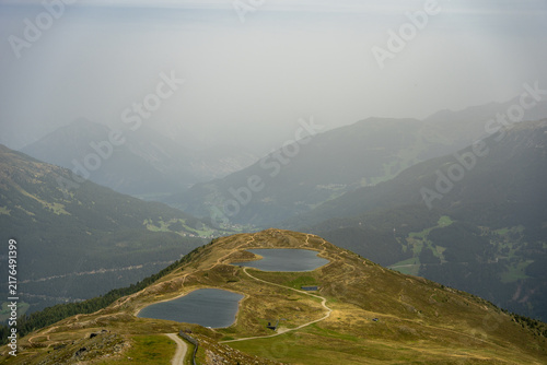 Panoramic Scenic Alpine Mountain Ridge With Two Lakes Overlooking Foggy Valley and Hiking Trails