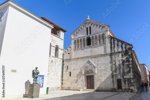 Bild auf Leinwand Romanesque facade of the church of St Chrysogonus with bronze statue, Zadar, Cro