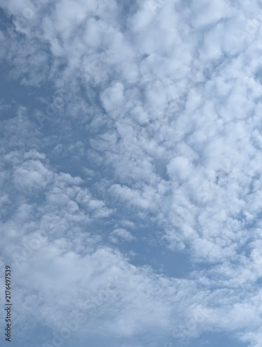 Canvas Print Beautiful cloudscape of soft fluffy clouds in a blue sky