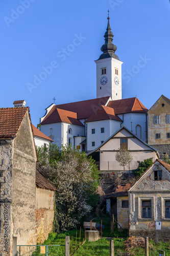 Canvas Print Baroque onion-domed clock tower of the parish church above old houses, Varazdins