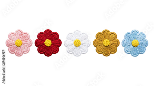 Five colorful embroidered daisy flower patches featuring detailed stitching with vibrant thread colors arranged in a horizontal line on transparent background