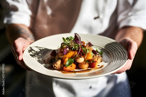 Chef presenting Mediterranean autumn vegetable dish