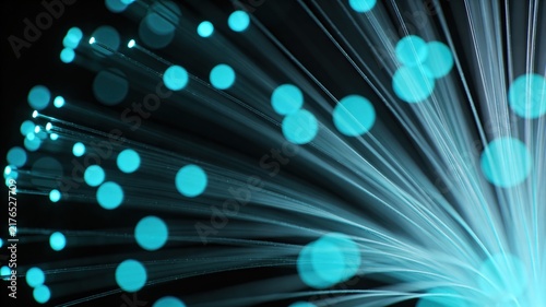 Abstract close-up of vibrant teal fiber optic cables glowing against a dark background, symbolizing high-speed data and modern communication