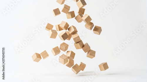 Natural wooden cubes tumbling in mid-air against a seamless white studio backdrop, motion frozen with high-speed photography, creating a dynamic cascade of light brown timber blocks