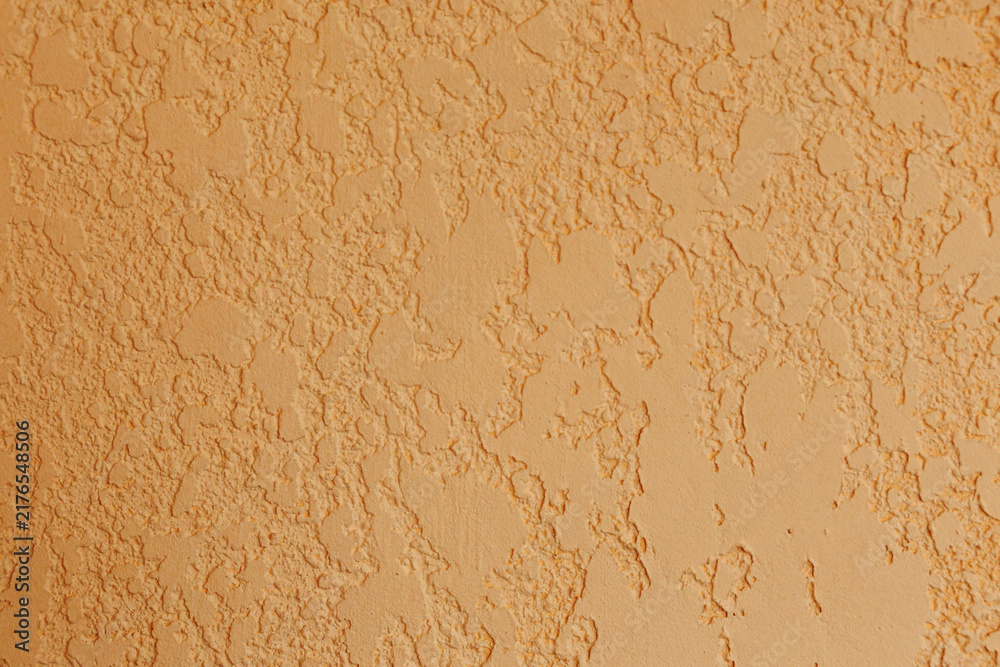 Fototapeta premium Decorative textured plaster wall surface in warm beige color