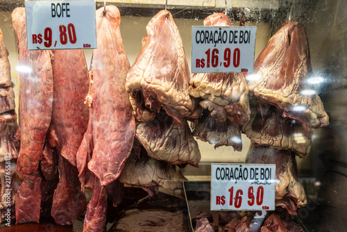 Fresh ox heart and lung arranged in a refrigerated display case at a butcher shop or supermarket. Sao Paulo, Brazil