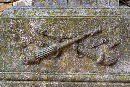 Carved Inverted Torches Relief Symbolizing Death on Antique Stone Tombstone