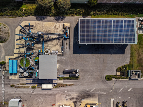 Aerial view of the Downer Sustainable Road Resource Centre and Asphalt Plant featuring industrial machinery and a large solar panel array in Brendale, Queensland, Australia.
