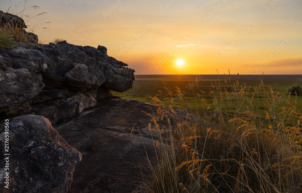 Obraz premium Stunning sunset due to smoke from bushfires at Ubirr and view over the Nadab floodplain, in Kakadu National Park, Australia 