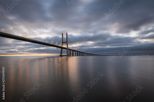 Canvastavla Vasco da Gama bridge over tagus river in Lisbon, Portugal, before sunrise