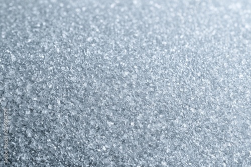 Extreme close-up of galvanized steel surface with sparkling crystalline zinc spangle texture