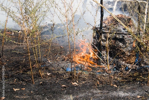 trash pile on fire
