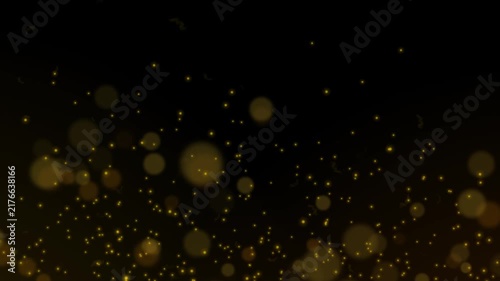 Bokeh effect with golden light particles floating across a dark background.