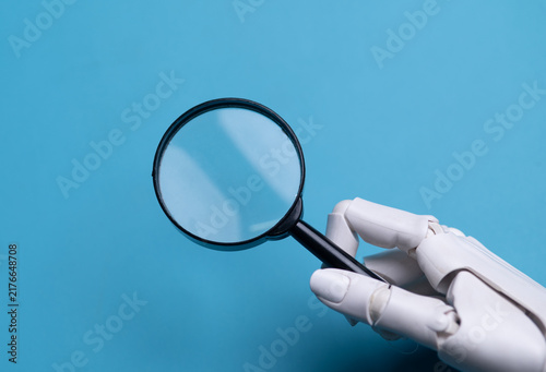 Robot Hand Holding Loupe Concept of Artificial Intelligence Search Analysis