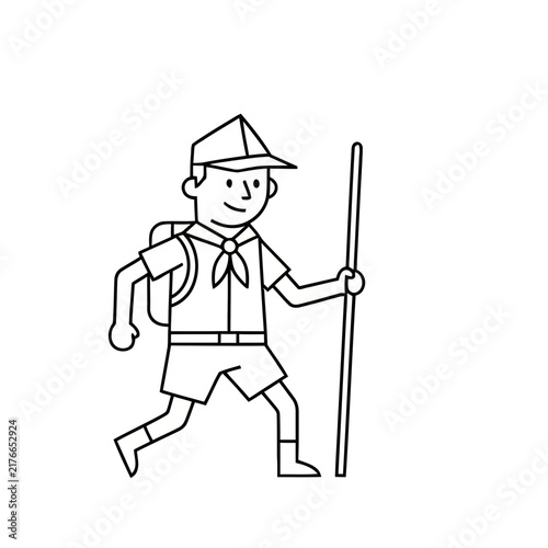 Scout walking with a stick and backpack