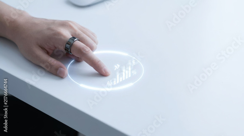 Digital finance audit concept with human hand interacting with glowing holographic chart on modern white desk