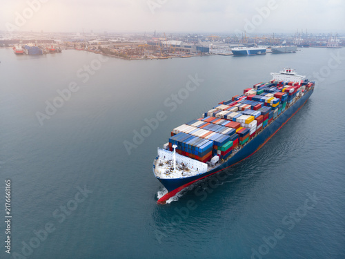 Foto Aerial View of Container Cargo Ship Transporting Freight Near Industrial Port