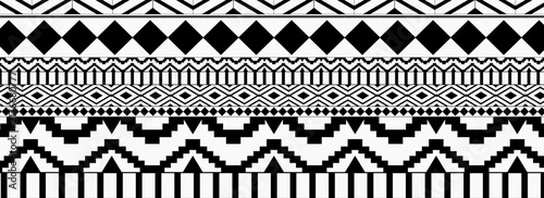 black-and-white tribal pattern consists of horizontal geometric bands featuring diamond chains, stepped zigzags, and vertical stripes arranged in a symmetrical, border-style layout.