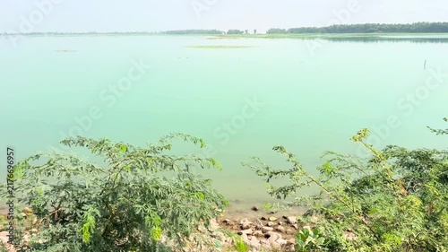 A breathtaking high-angle view of a vast tranquil lake stretching across the landscape. 4k video
