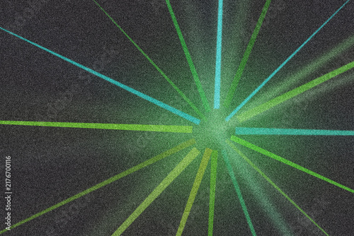 Green and cyan radial light rays burst from center on grainy black background for design.