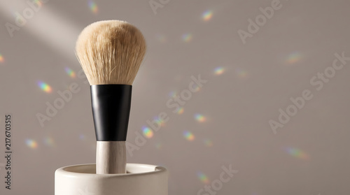 Obraz na płótnie Makeup Brush Standing with Rainbow Light Flare