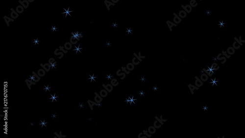 Glowing blue stars twinkling floating on black background
