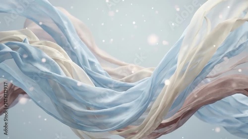 Flowing, translucent fabric ribbons in shades of blue, cream, and pink swirling gracefully with a soft bokeh background