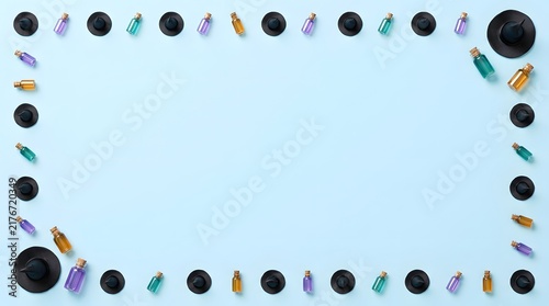 Top view of a decorative halloween border frame made with small black pumpkins on a light blue background
