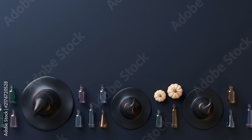 A festive halloween flat lay composition featuring small glass bottles and decorative pumpkins on a dark background surface