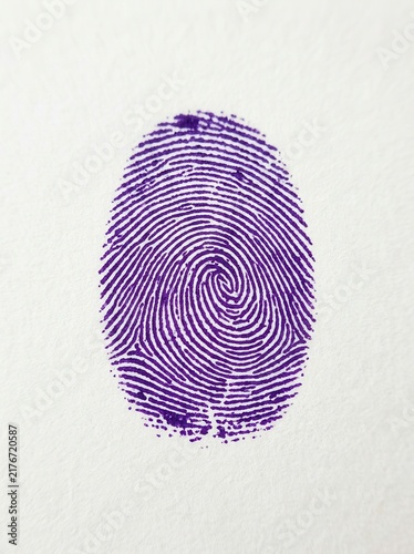 Unique Purple Fingerprint Identification Mark On White Paper Texture Background