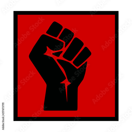 Foto Black raised fist symbol on a red background representing protest and power for