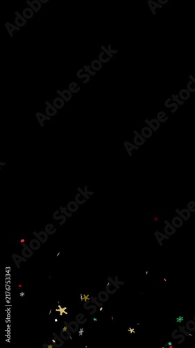Christmas snowflake colorful confetti burst overlay on black background with green screen