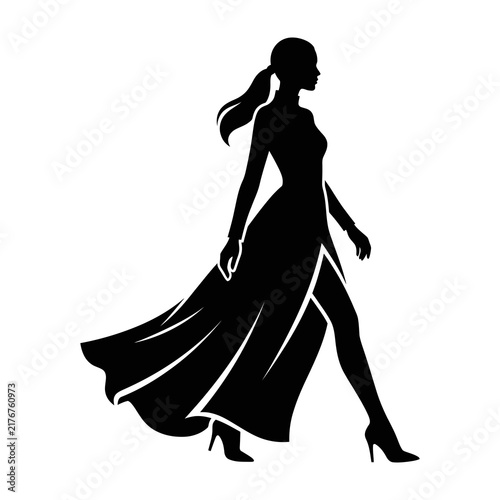 Foto Woman in elegant dress walking with flowing skirt and high heels from side