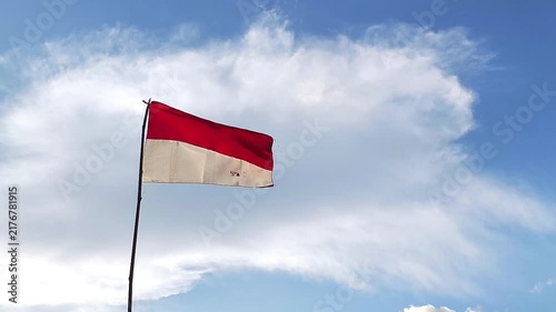 waving flag of Indonesia against blue sky, part 2