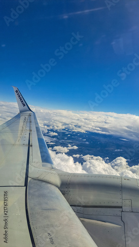 Flying an airplane above the clouds
