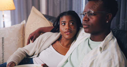 Canvastavla Streaming, love and couple in house with snack, movie binge or watching tv on weekend break