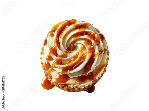 Top view of a delicious cupcake with white frosting and caramel sauce drizzle isolated