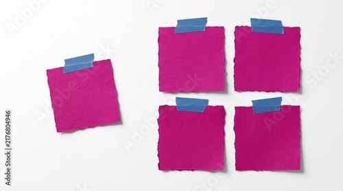 Naklejka Five purple paper notes attached with blue tape
