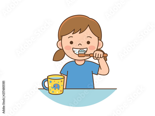 Young girl brushing teeth with colorful cup.