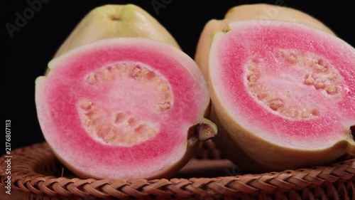 Fresh pink guava fruit with whole and half slice