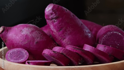 Japanese purple sweet potato in a wooden plate.