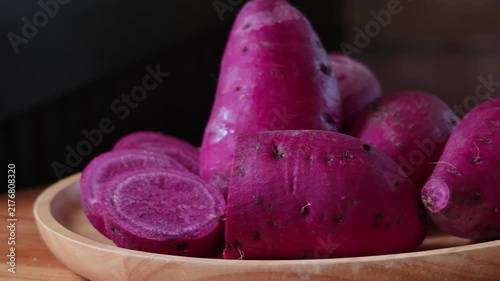 Japanese purple sweet potato in a wooden plate.