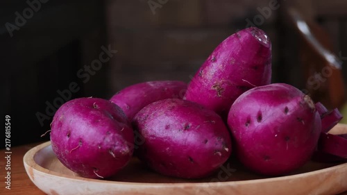 Japanese purple sweet potato in a wooden plate.