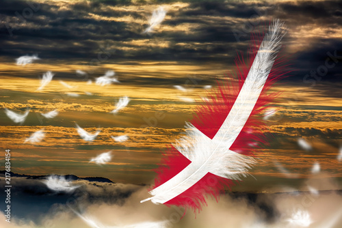 3D illustration. Flag of Denmark on a feathers fluttering in the sky background.