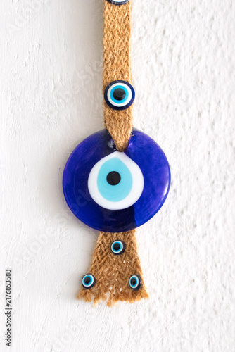 In Turkish culture, It's believed; traditional blue bead (amulet) is against the evil eye. Copy space, blank, empty. Vertical photo. No people, nobody.
