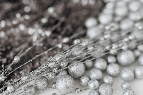 Fotografie Glitter silver baubles and sequin textile