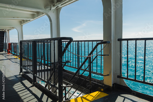 Картината върху платно Ferry Side Walkway and Stairway Overlooking Turquoise Sea